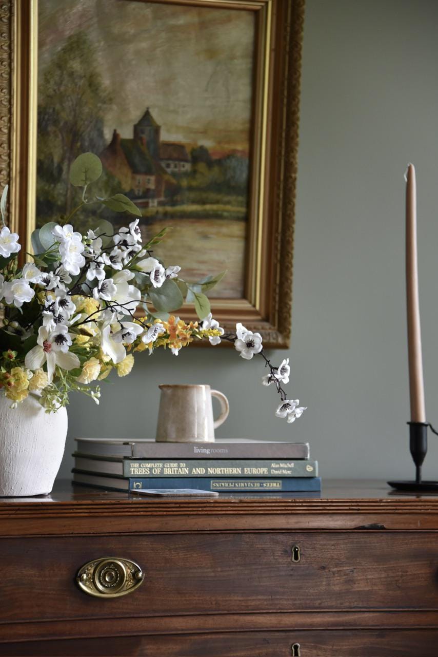 close up of Large Ivory and Yellow Flower Arrangement including white blossom, yellow catmint flowers, stephanotis, magnolias, yellow carnations and green eucalyptus  