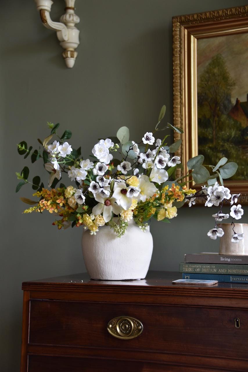 Large Ivory and Yellow Flower Arrangement including white blossom, yellow catmint flowers, stephanotis, magnolias, yellow carnations and green eucalyptus  