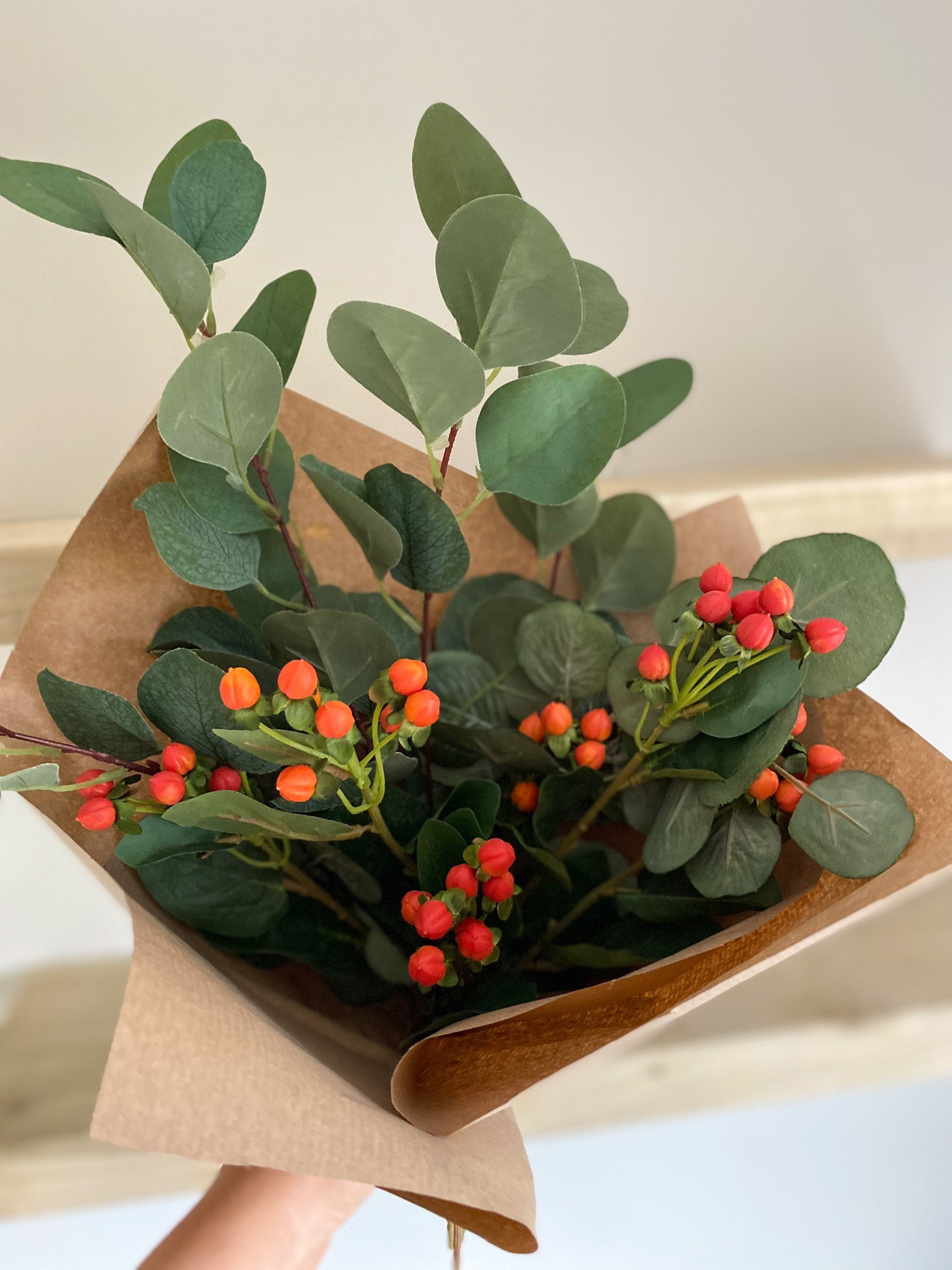 Red and Orange Hypericum Berries with Green Eucalyptus