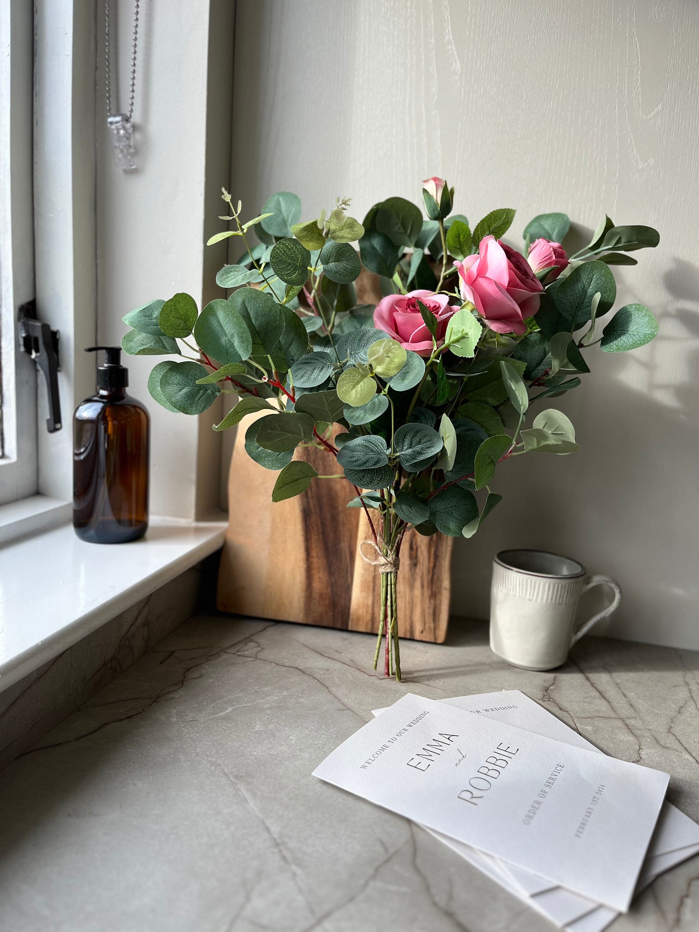 Old garden roses with eucalyptus. Tied with hessian string and delivered in brown Kraft paper.