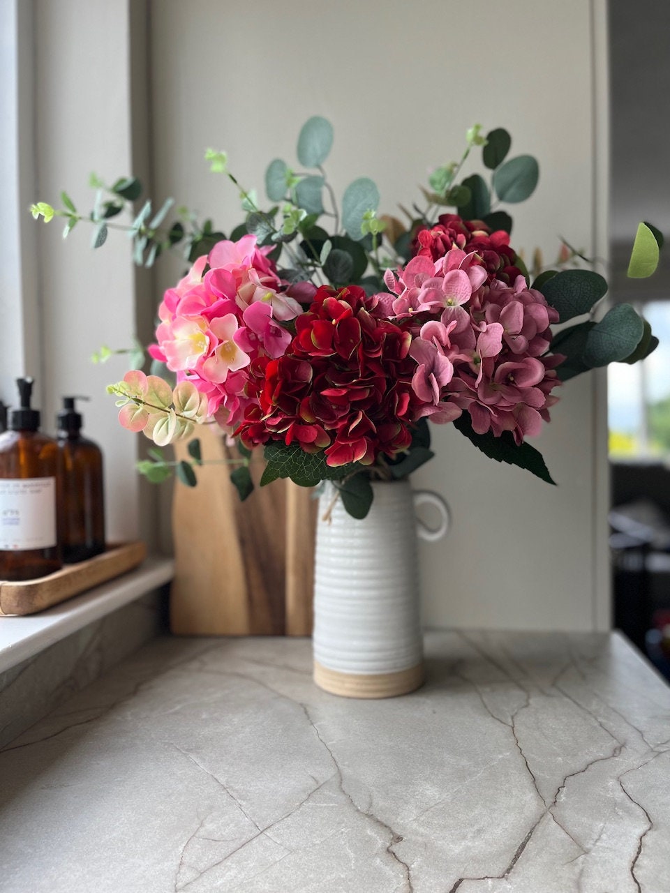 Pink and red hydrangeas with Green eucalyptus